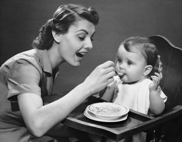 Mother feeding baby Mother feeding baby