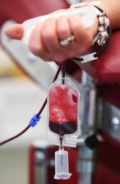 A person donating blood. A person donating blood.