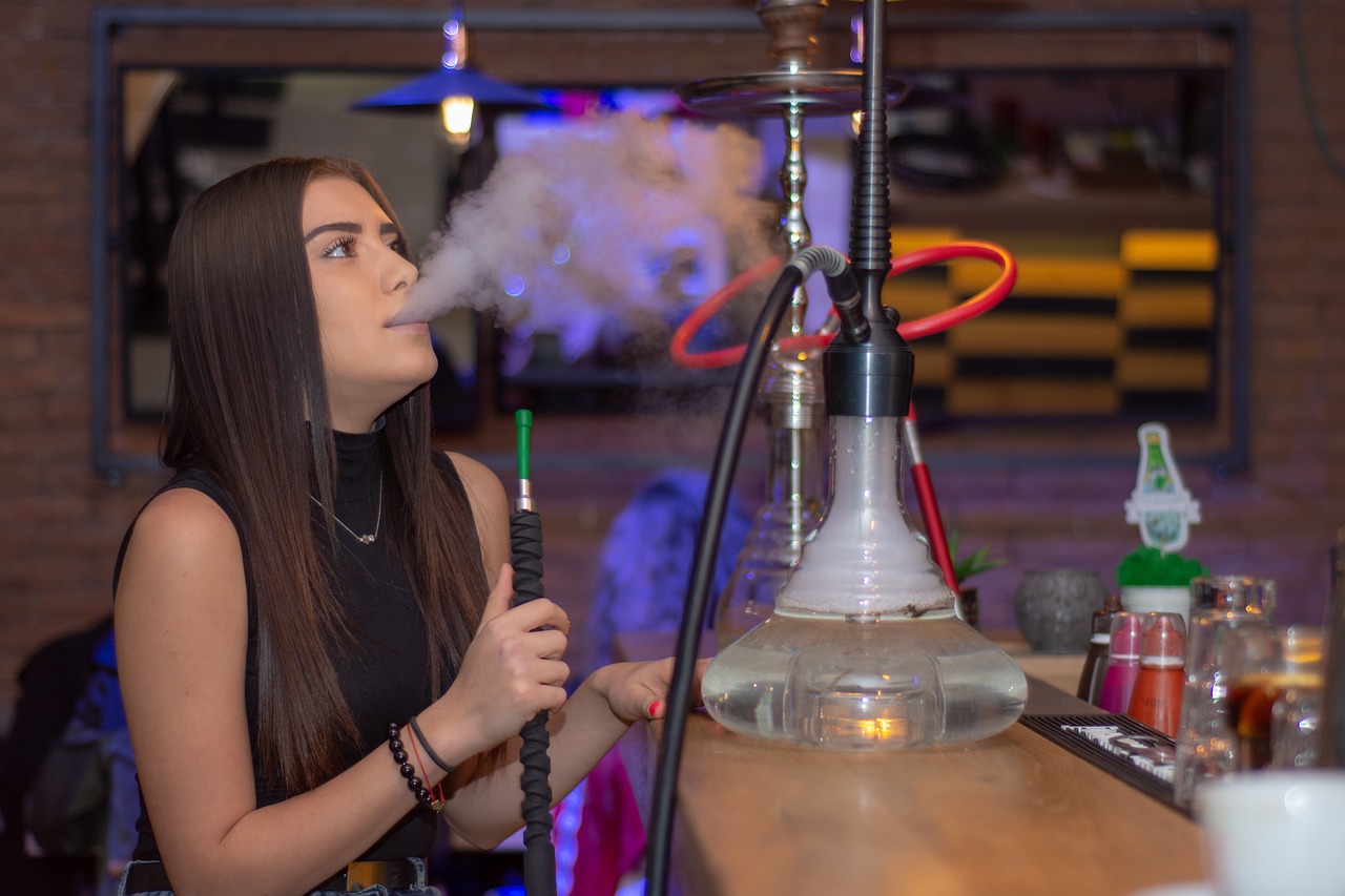 Woman smoking Hookah Woman smoking Hookah