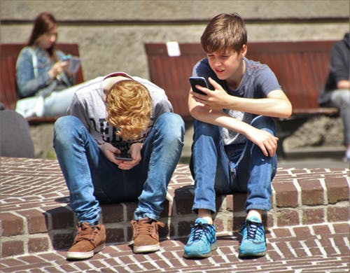 Youth using mobile Youth using mobile