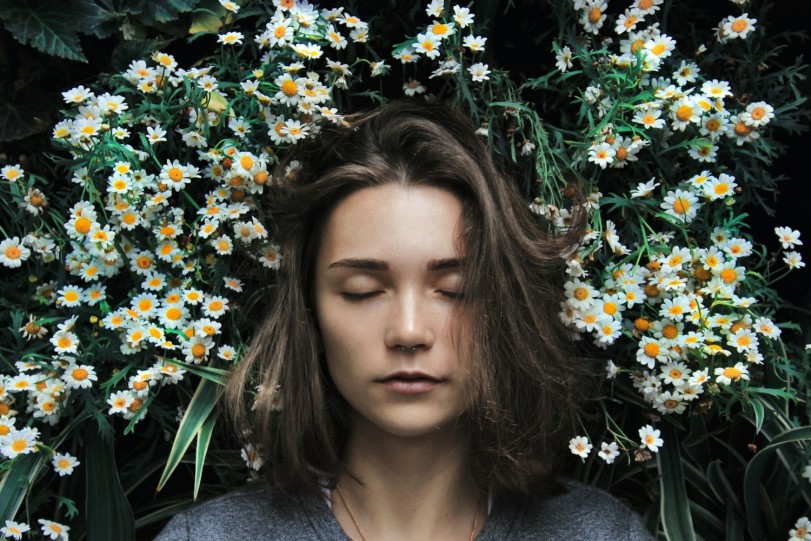 girl sleeping on flower grass