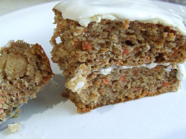 A piece of gluten-free carrot cake, something that can be enjoyed by people with celiac disease. 