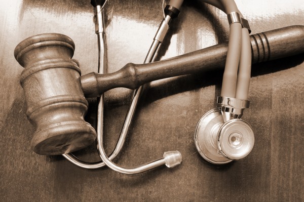 Lawsuits filed against a doctor lead him to give up his medical license for good.