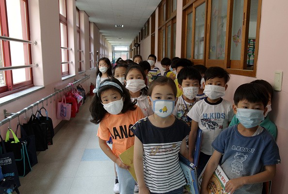 Children in a South Korean school wear masks to prevent the spread of MERS. A second case has been confirmed in the Philippines.