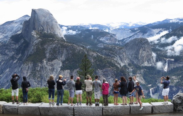 Tourists at Yosemite National Park Enjoying the views. One campground at Yosemite has been closed because of precautions against plague.