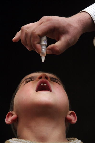 A child receiving the oral polio vaccine. Two children in Ukraine have contracted polio because of low vaccination rates there. 