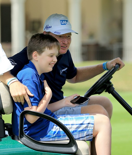 Pro golfer Ernie Els and his son, Ben, who has autism. 