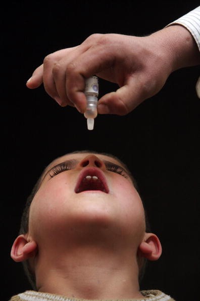 A child receiving the oral polio vaccine. 