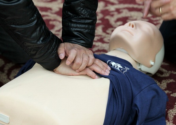A person practicing CPR on a dummy. Knowing how to perform CPR can help save someone suffering cardiac arrest. 