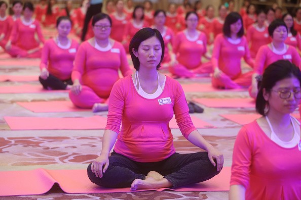 Pregnant women in China in a yoga class. 