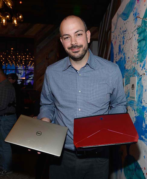 LAS VEGAS, NV - JANUARY 07: Dell General Manager of Alienware and XPS Frank Azor holds the gold Dell XPS 13 and Alienware OLED laptops during an intimate dinner at Yardbird at The Venetian Las Vegas on January 7, 2016 in Las Vegas, Nevada.
