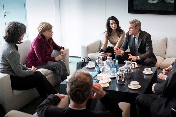 Amal and George Clooney meet with Angela Merkel