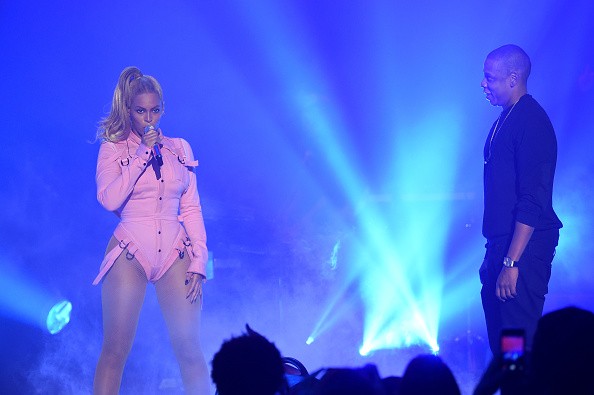 Beyonce (L) and Jay-Z perform onstage during TIDAL X: 1020 Amplified by HTC at Barclays Center of Brooklyn on October 20, 2015 in New York City