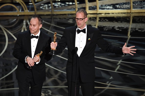 Producer Jonas Rivera (L) and director Pete Docter accept the Best Animated Feature Film award for 'Inside Out' onstage at the 88th Annual Academy Awards on Feb. 28