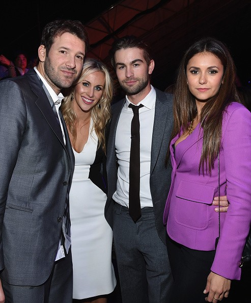 L-R) NFL player Tony Romo, Candice Crawford, actor Chace Crawford, and actress Nina Dobrev attend DirecTV Super Saturday Night hosted by Mark Cuban's AXS TV and Pro Football Hall of Famer Michael Strahan at Pendergast Family Farm on January 31, 2015 in Gl