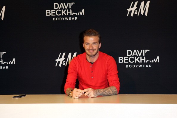 David Beckham signs autographs for fans during the launch of his H&M Bodywear Collection at H&M on May 24, 2013 in Paris, France