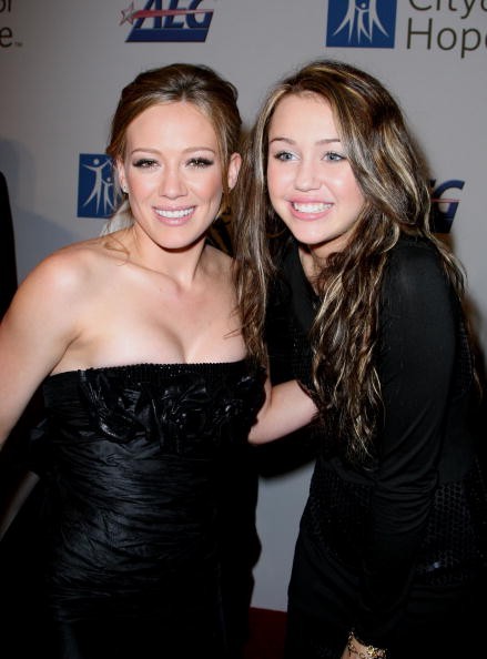 Singer Hilary Duff and singer Miley Cyrus arrive at the City of Hope Spirit of Life Award dinner Honoring Disney Music Group Chairman Bob Cavallo held on September 27, 2007 in Los Angeles, California. 