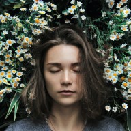 girl sleeping on flower grass