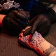 getting inked on the hand