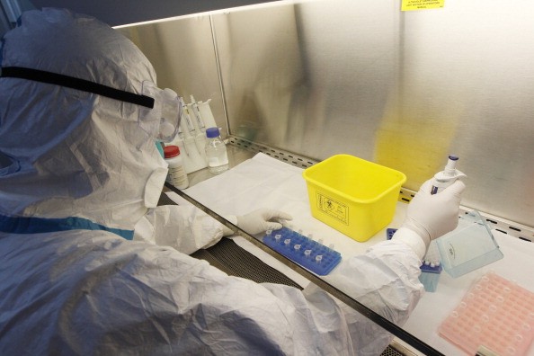 Researchers working with viruses in a laboratory. 