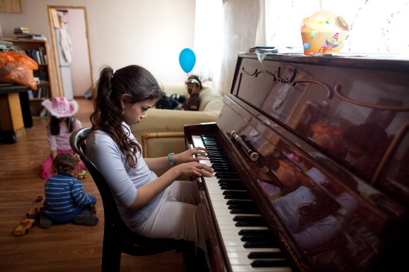 Learning to play a musical instrument like the piano is good for a child's brain.